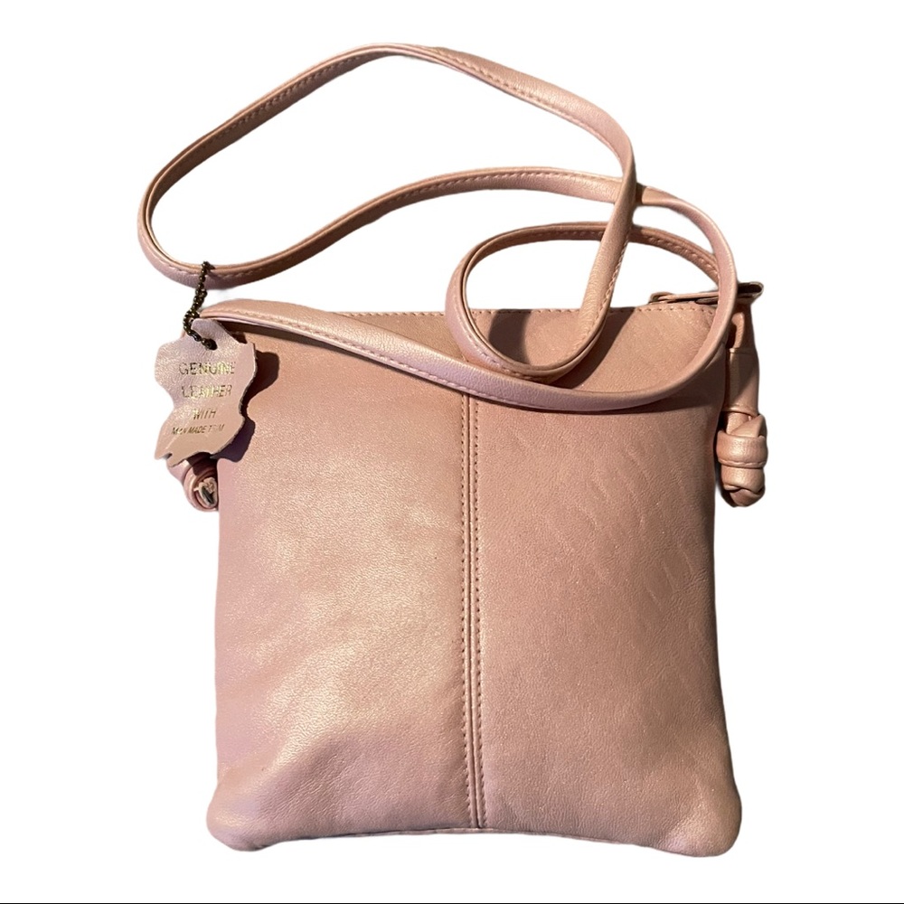 Iridescent pastel pink crossbody leather bag.